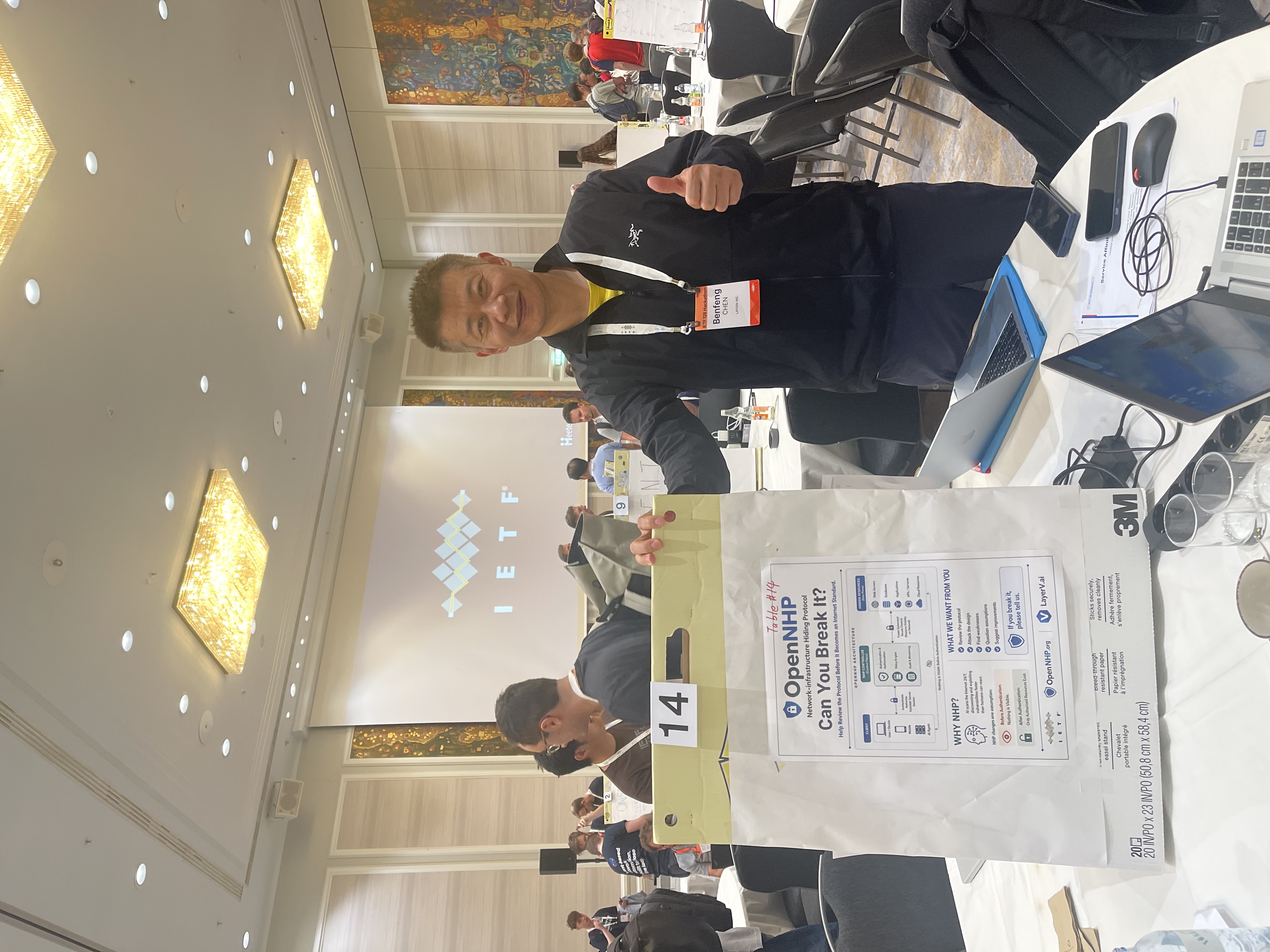 Benfeng Chen at the OpenNHP table, IETF 126 Hackathon.